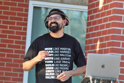 Dr. Rob smiling at the DJ turntable