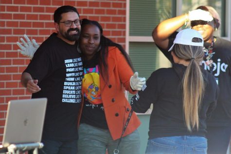 Dr. Rob receives a hug from Math Jam volunteer